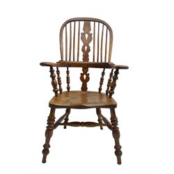 Elm and beech high back Windsor chair,  high hoop back with pierced splat and spindle supports over shaped saddle seat, raised on ring turned supports united by H-stretcher