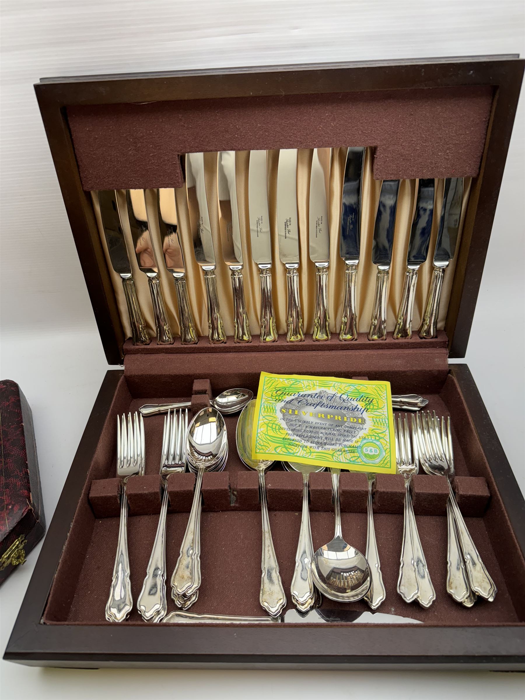 Canteen of cutlery for six, in a oak case, together with two other canteens 