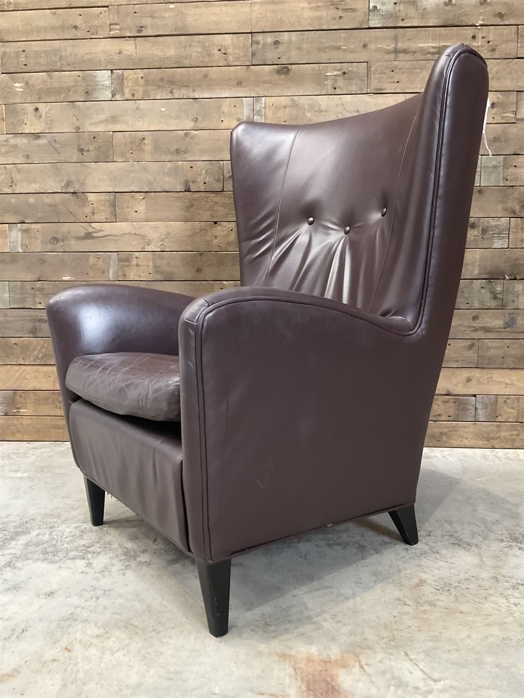 Wing back armchair upholstered in cocoa brown leather