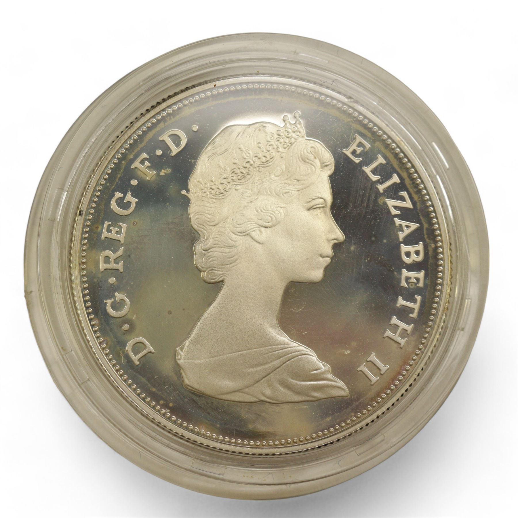 Eight The Royal Mint United Kingdom silver proof coins, comprising 1980 '80th Birthday' crown, 1981 'His Royal Highness The Prince Of Wales And Lady Diana Spencer' crown, 1984, 1985, 1986 and 1987 one pounds, all cased with certificates and a 1977 crown cased no certificate (8)