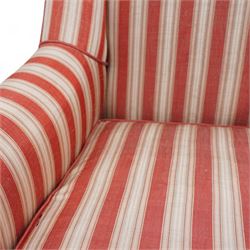 Edwardian hardwood-framed armchair, with rolled arms upholstered in red striped fabric, on square tapering front feet with brass and ceramic castors 