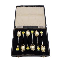 Set of six silver coffee spoons, each with enamelled daffodil decoration to terminal, hallmarked Turner & Simpson Ltd, Birmingham 1938, contained within fitted case