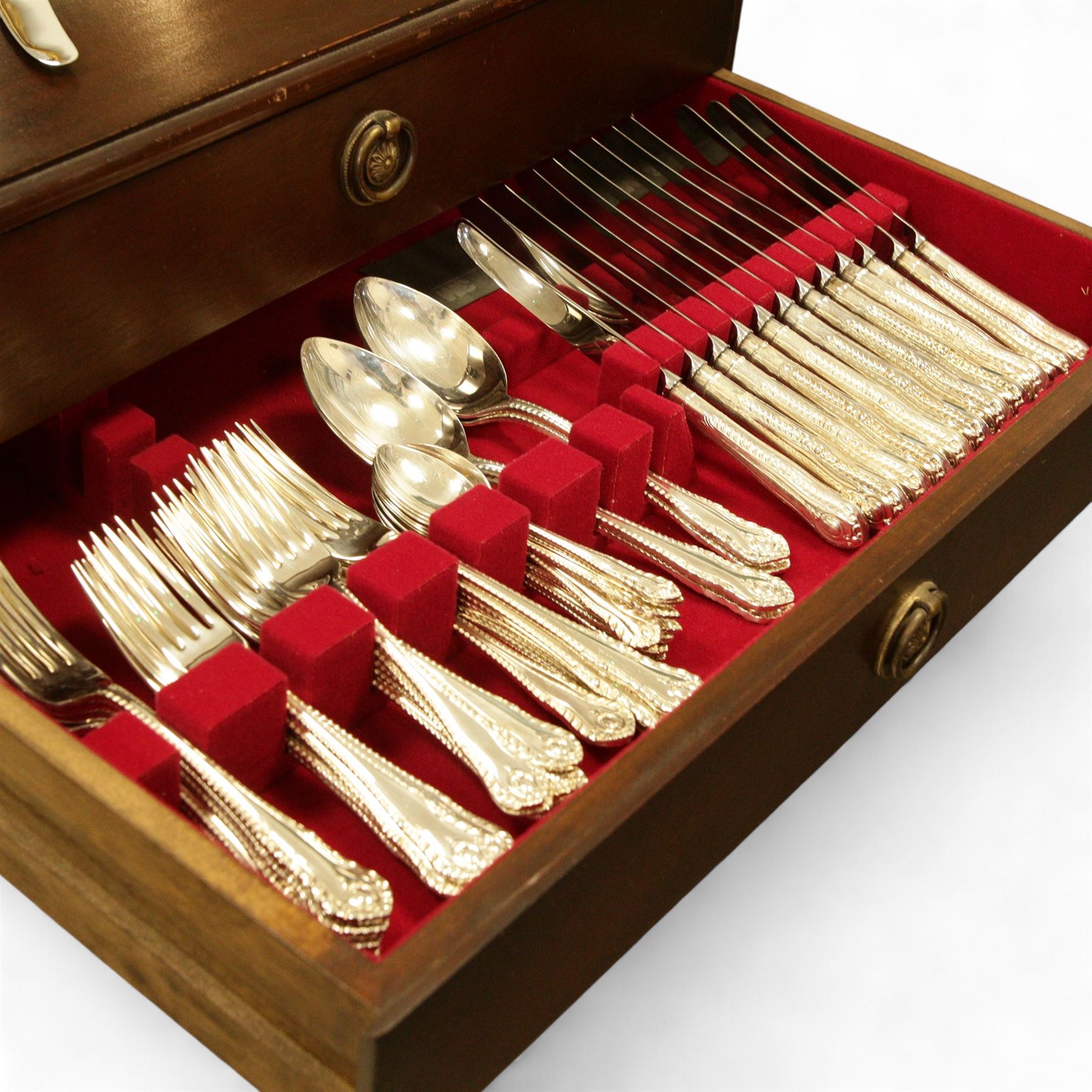 George Butler & Co. canteen of silver plated cutlery, for eight persons, plus additional cutlery, including a set of six silver teaspoons, pair of white metal salad servers and various silver-plated and brass flatware, in a three-drawer mahogany canteen case raised on cabriole legs