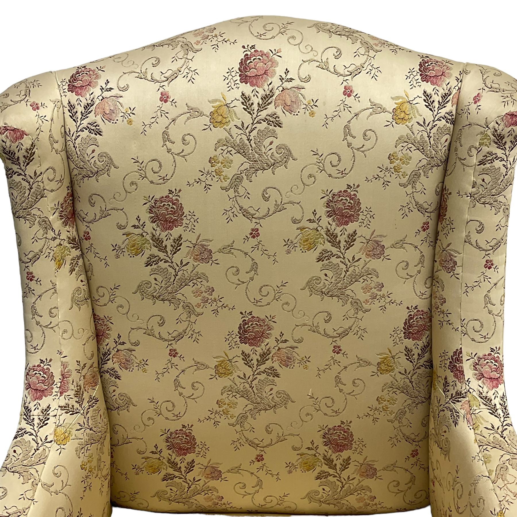 Edwardian hardwood-framed armchair, upholstered in floral pattern fabric, on square tapering front supports, brass and ceramic castors 