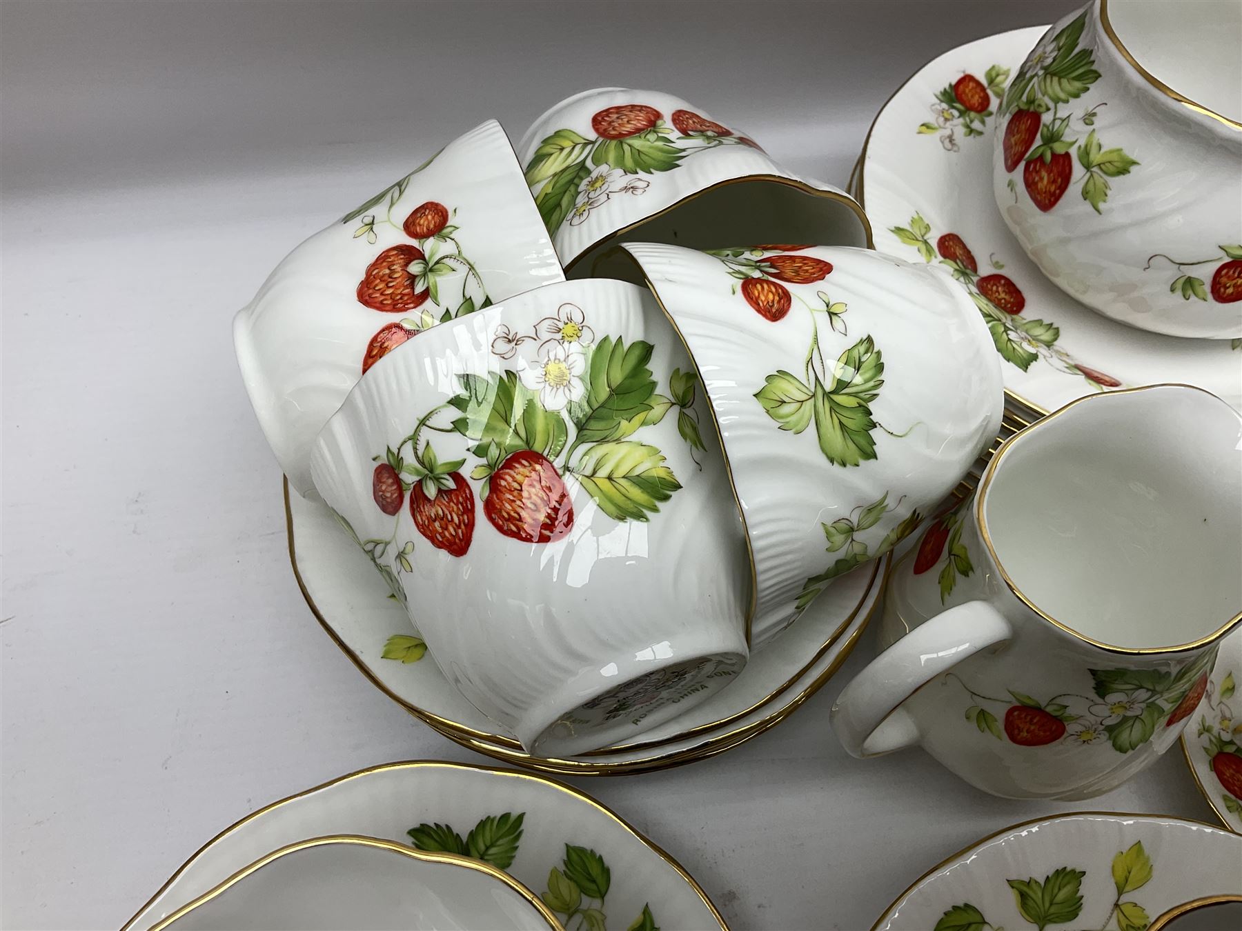 Ringtons and Queen's China Virginia Strawberry pattern teawares, including teacups, saucers, milk jugs, sugar bowls, etc