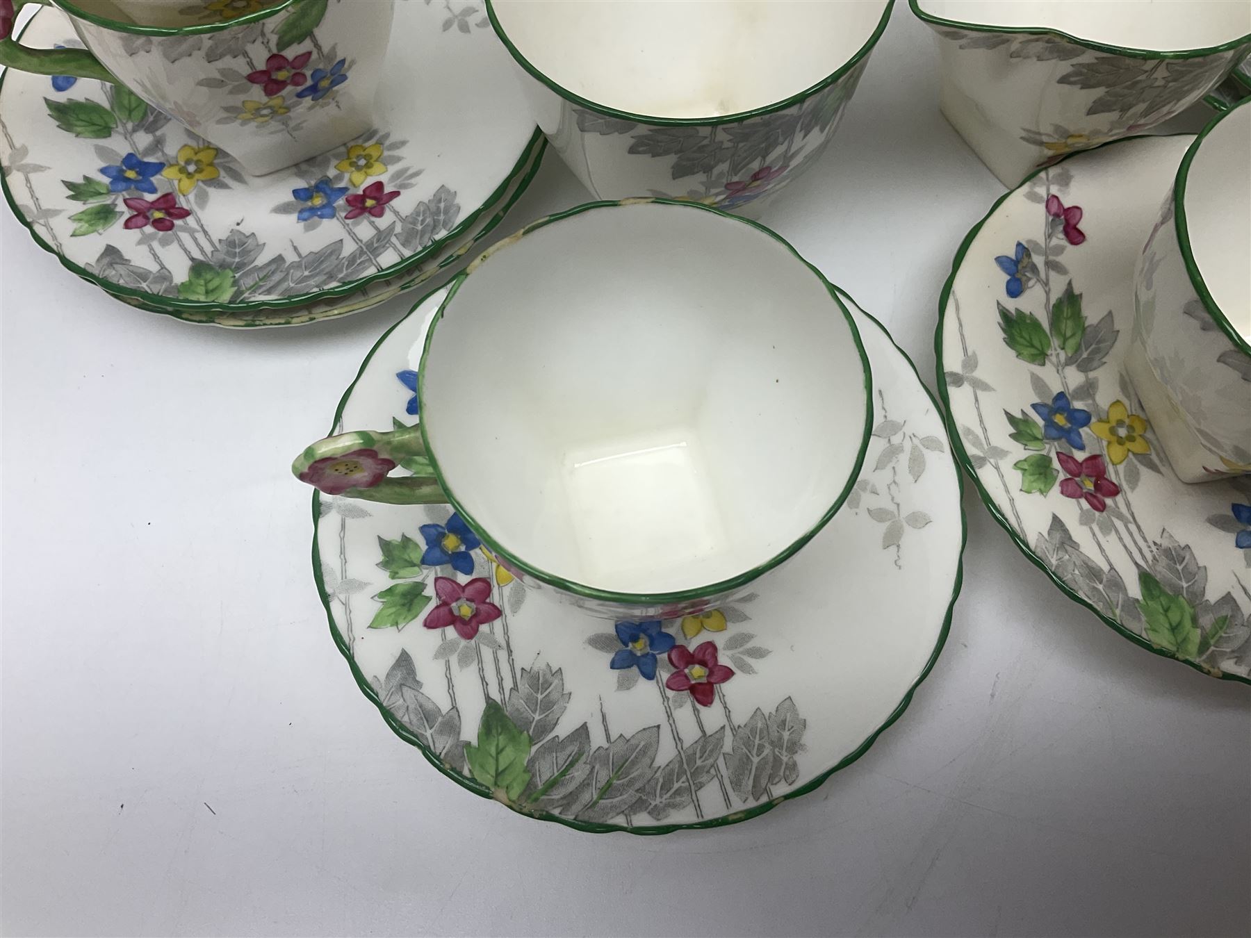 Art Deco Delphine China coffee service for six, comprising coffee pot, open sucrier, milk jug, cups and saucer, with floral decoration