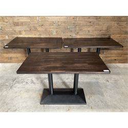 Three dark walnut rectangular console restaurant tables, on black metal bases