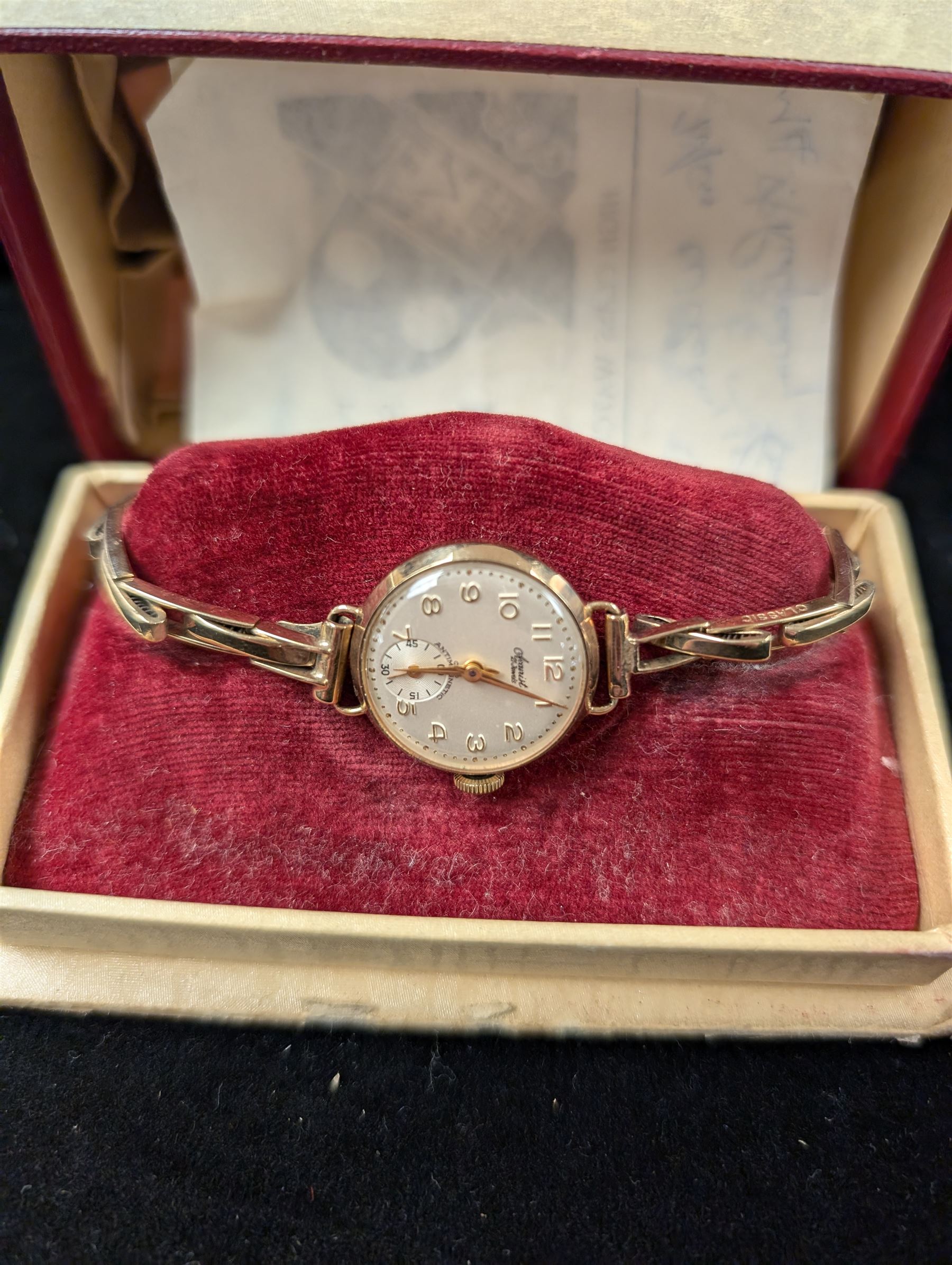 9ct gold cased manual wind ladies Accurist 21 Jewel wristwatch on a 9ct gold spring loaded, boxed 