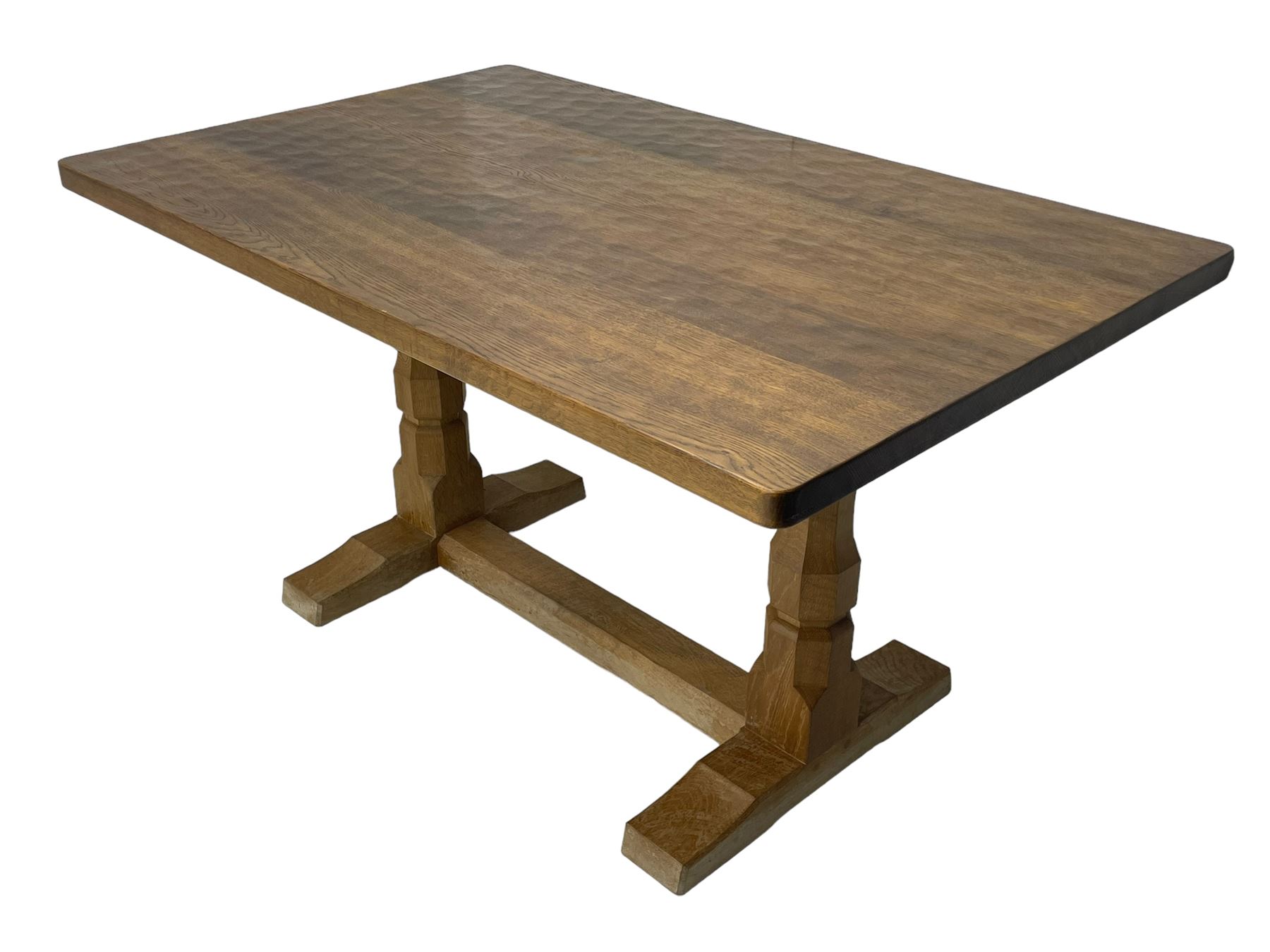 Mouseman - oak dining table, rectangular adzed top with rounded corners, octagonal pillar supports on sledge feet united by floor stretcher, carved with mouse signature, by the workshop of Robert Thompson, Kilburn