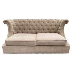 Grande wing back sofa bed, upholstered in beige buttoned fabric, metal action pull out double bed