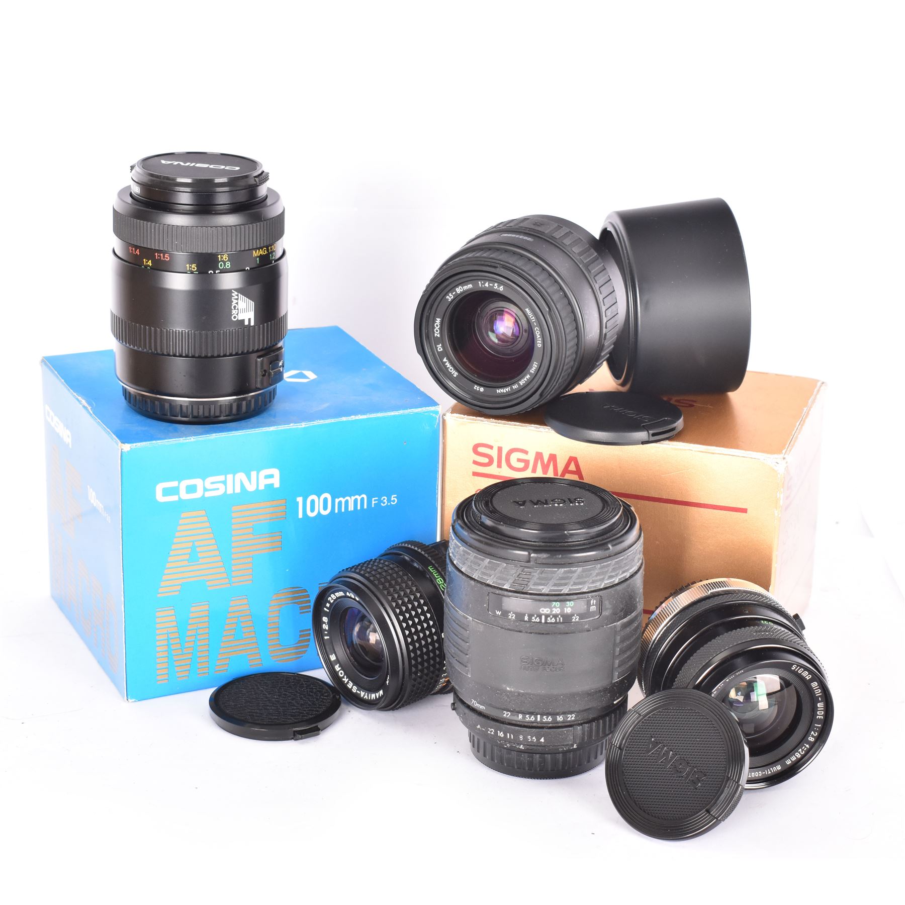 Group of camera lenses, comprising Cosina 100mm 1:3.5 MC Macro lens serial no. 9924159, Sigma DL Zoom 35-80mm 1:4-5.6 serial no 2031995, both boxed, Sigma UC Zoom 70-210mm 1:4-5.6 lens serial no. 1014147 and a Sigma Mini-Wide 1:2.8 f=28mm lens serial no. 261735, etc