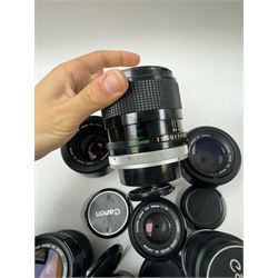 Seventeen Canon camera lenses, mostly FD examples, including 28-85mm 1:4 serial no, 49881, 35-105mm 1:3.5-4.5 serial no. 87632 and 135mm 1:2.8 serial no. 48336, one boxed