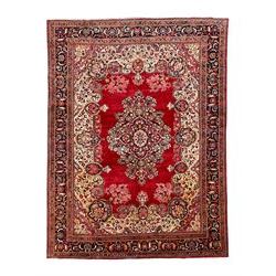 Persian Tabriz crimson ground carpet, central medallion with extending floral decoration o...