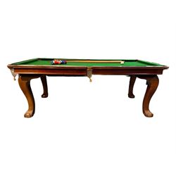 Riley - mahogany slate bed snooker dining table, green baize playing surface fitted with leather net pockets, raised on cabriole supports ending in ball and claw feet; together with set of Riley cues, balls and scoreboard