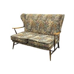 Lucian Ercolani for Ercol - mid-20th century beech and elm 'Windsor 203' two-seat sofa, wingback design upholstered in floral pattern over sprung seat and backrest, open curved arms, on splayed supports with stretchers (W133cm, D87cm, H90cm); matching easy chair (W70cm, D97cm, H82cm)