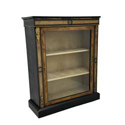 Victorian ebonised and walnut pier cabinet, rectangular top over figured frieze with central star motifs, enclosed by single glazed door, decorated with cast gilt metal mounts and beading, on chamfered plinth base 