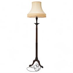 Early 20th century stained beech standard lamp, turned column with fluted and reeded decoration, on three out splayed supports with ball and claw feet, with presentation plaque and shade 