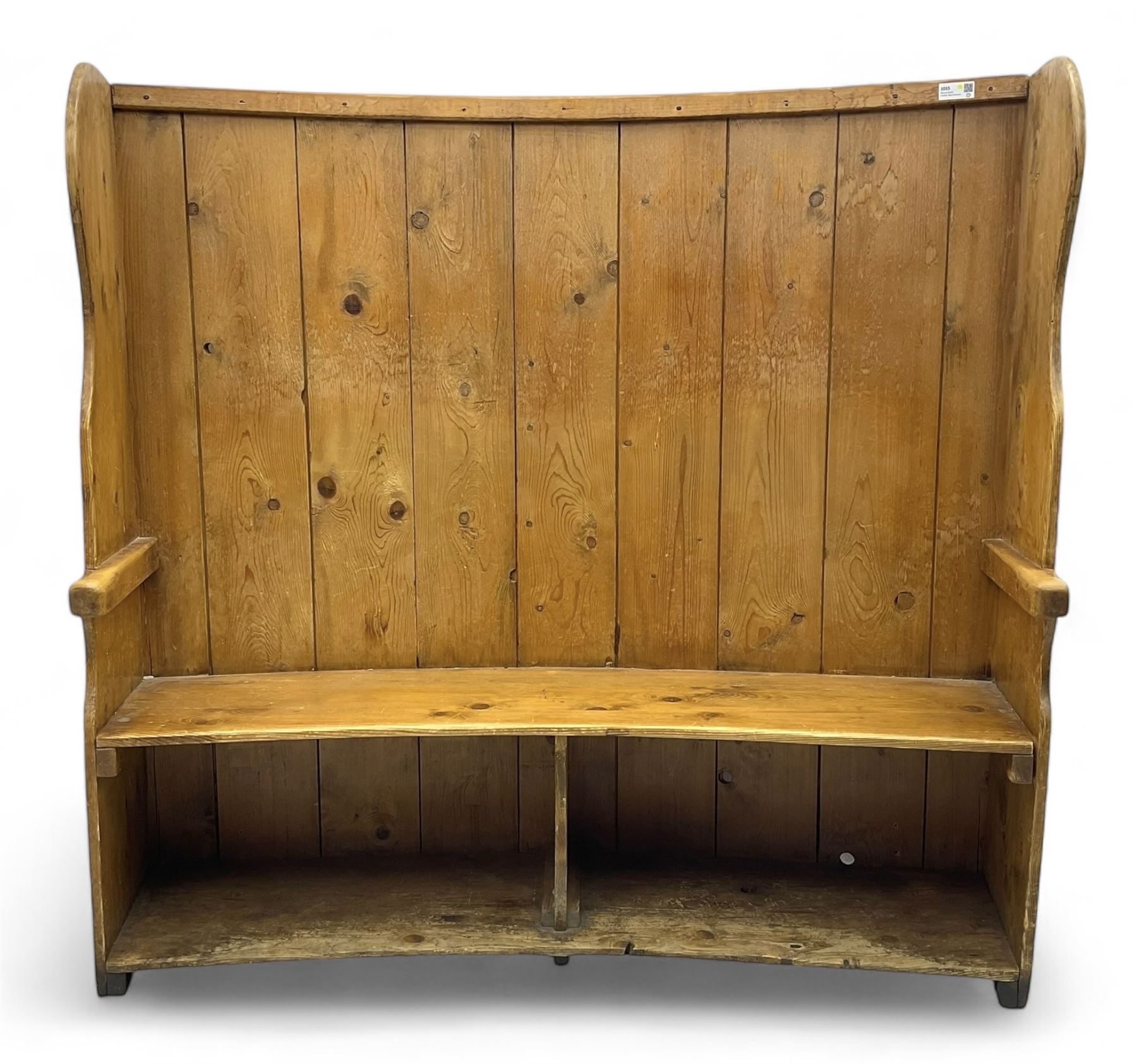 19th century pine barrel back settle, bowed boarded back on shaped end supports, with upholstered squab cushion 