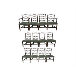 Set of twelve (10+2) Chippendale revival stained beech dining chairs, pierced waived ladder backs with over-stuffed over seats, on square moulded supports joined by stretchers