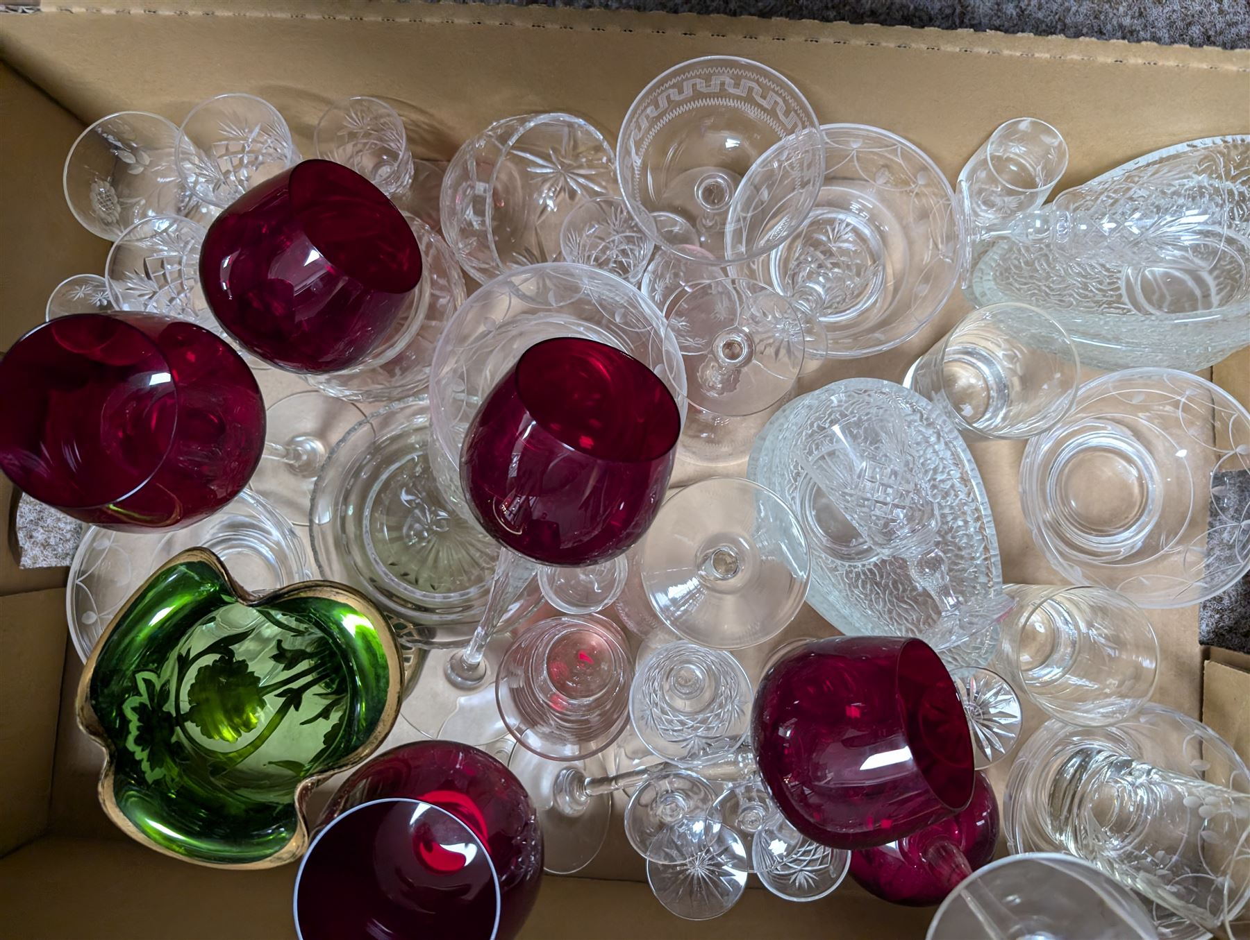 Large collection of glassware, including coloured and cut glass, in three boxes