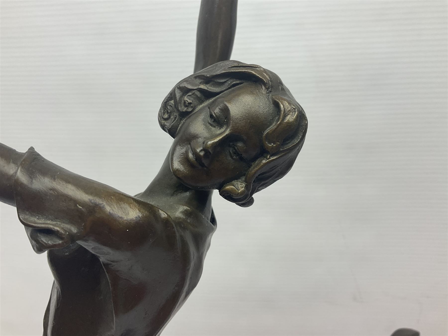 Art Deco style bronze, after Bruno Zach, modelled as a dancer with her arms raised, on a veined marble tapering base signed B. Zach and with foundry seal, H65cm