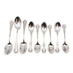 Group of American silver flatware, comprising set of three table spoons, each with beaded stem and engraved with initialsm marked for Mermod & Jaccard Jewelery Co. and a set of six American silver dessert spoons, each engraved with initial in a scrolling border, stamped Sterling