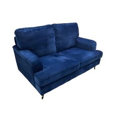 Howard design - two-seat sofa upholstered in blue fabric, traditional shape with rolled arms, on walnut finish turned feet with brushed metal cups and castors