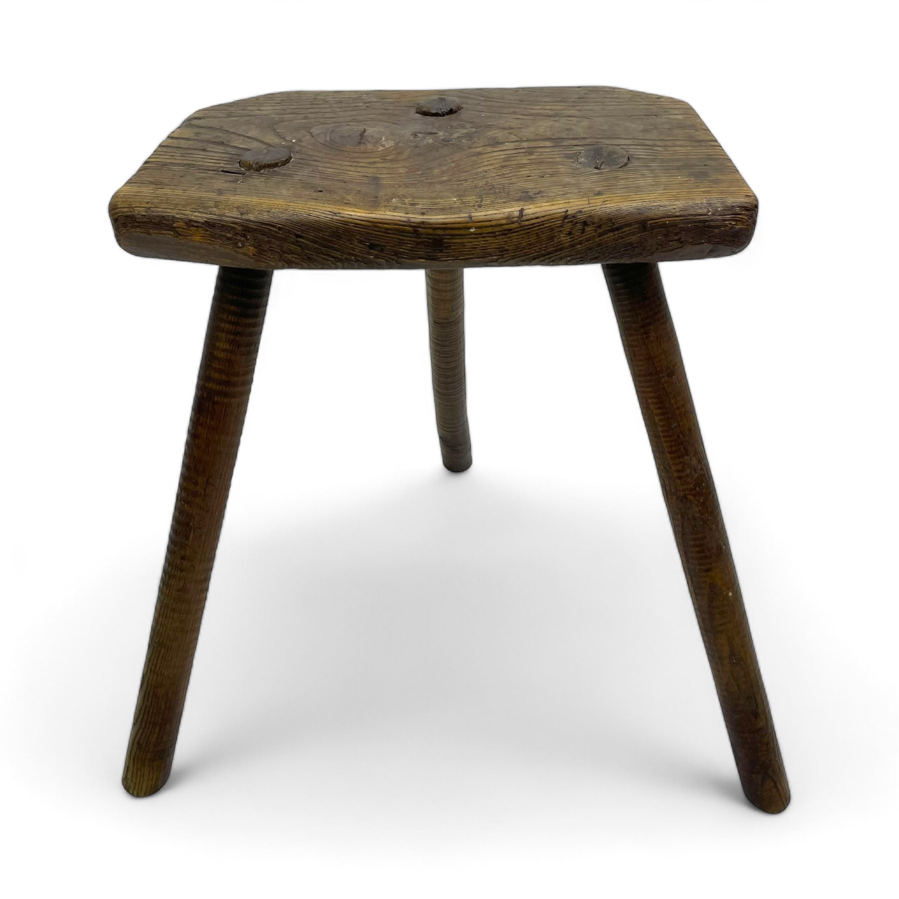 19th century elm cutler's stool, shaped seat on three rib turned supports