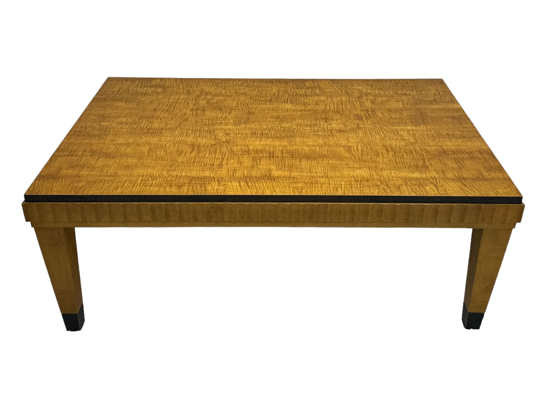 Art Deco design maple wood coffee table, rectangular top with reeded edge, on tapered supports with metal feet protectors