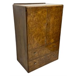 Early 20th century burr walnut cabinet, rectangular top with raised back, over double-door cupboard enclosing camphor interior with single shelf, lower section fitted with two drawers