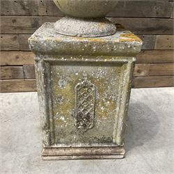 Cast stone vase shaped urn, mounted on square plinth