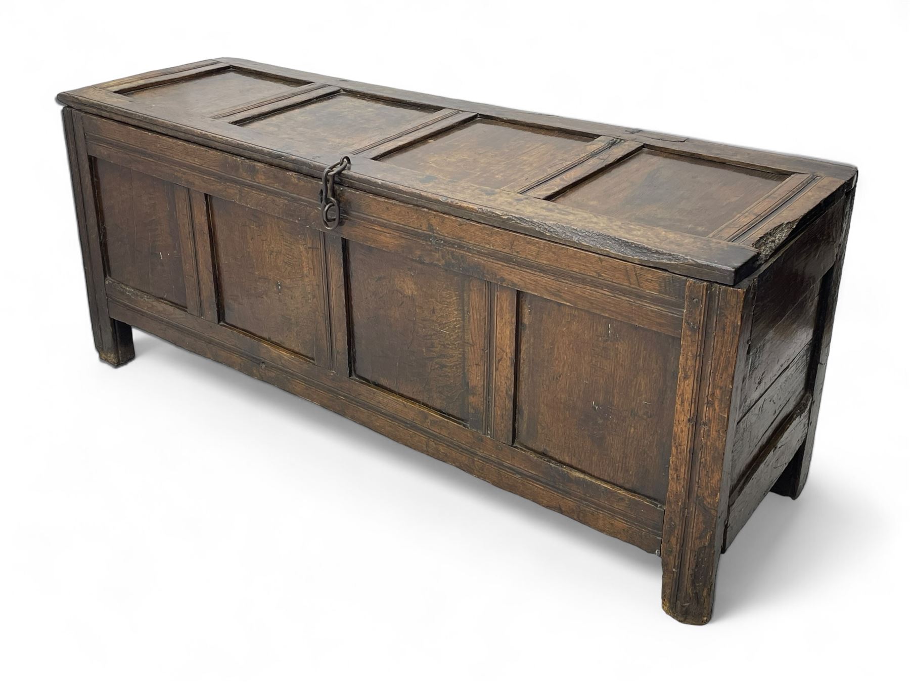 17th century panelled oak blanket chest or kist, quadruple panelled hinged lid over quadruple panelled front, moulded frame and pegged construction, on stile supports