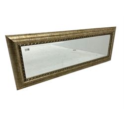 Rectangular wall mirror in gilt famed, bevelled glass plate