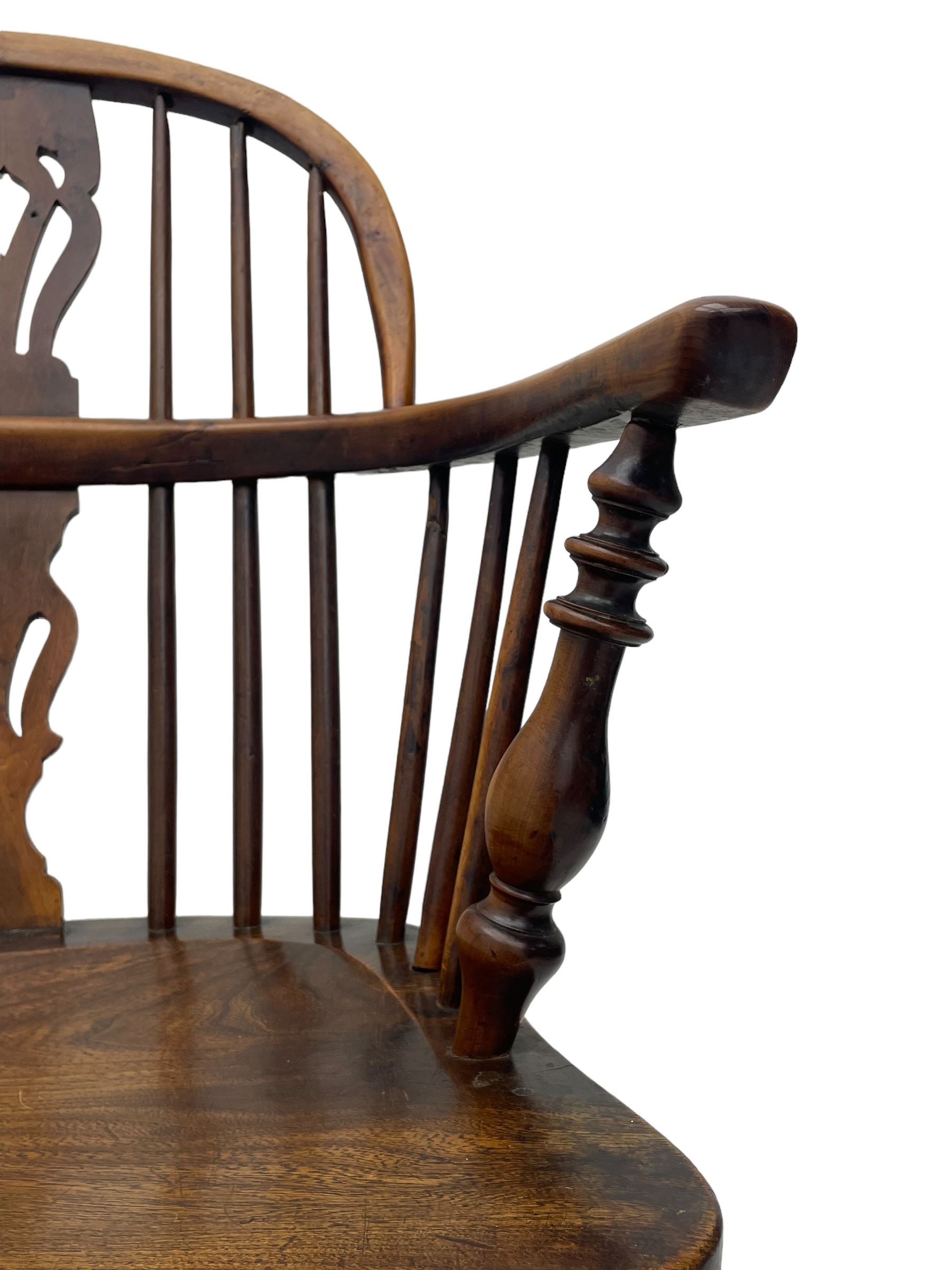 19th century yew wood and elm Windsor armchair, low double hoop stick and pierced splat back, dished seat on turned supports united by crinoline stretchers