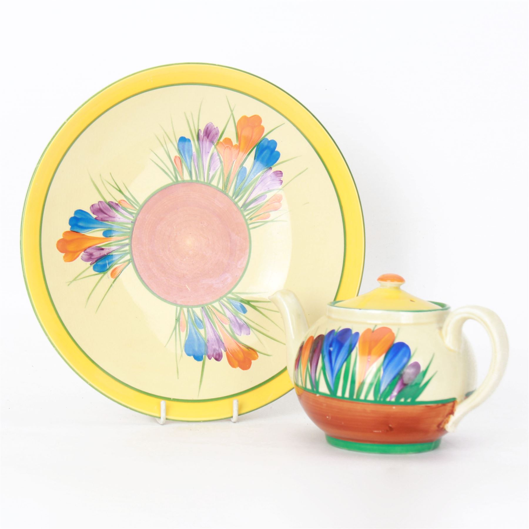 Clarice Cliff Bizarre 'Crocus' pattern teapot, H10cm, together with a Clarice Cliff Bizarre 'Crocus' pattern plate, D23cm, each with Crocus and Bizarre marks beneath, (2)