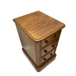 Pair of Victorian figured mahogany pedestal chests, rectangular form with rounded front corners, moulded top over three drawers with applied mouldings and turned handles, on moulded plinth base