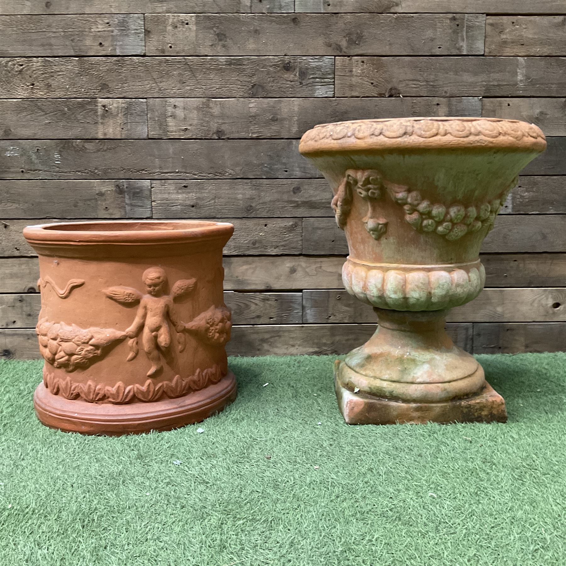 Circular terracotta garden planter, decorated with cherubs and terracotta urn on plinth - THIS LOT IS TO BE COLLECTED BY APPOINTMENT FROM DUGGLEBY STORAGE, GREAT HILL, EASTFIELD, SCARBOROUGH, YO11 3TX