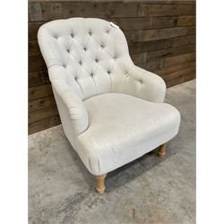 Armchair upholstered in button back linen fabric