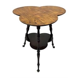 Late 19th to early 20th century stained beech 'Gypsy' table, trefoil or clover shaped top on turned supports united by undertier, on cast metal and glass ball feet 