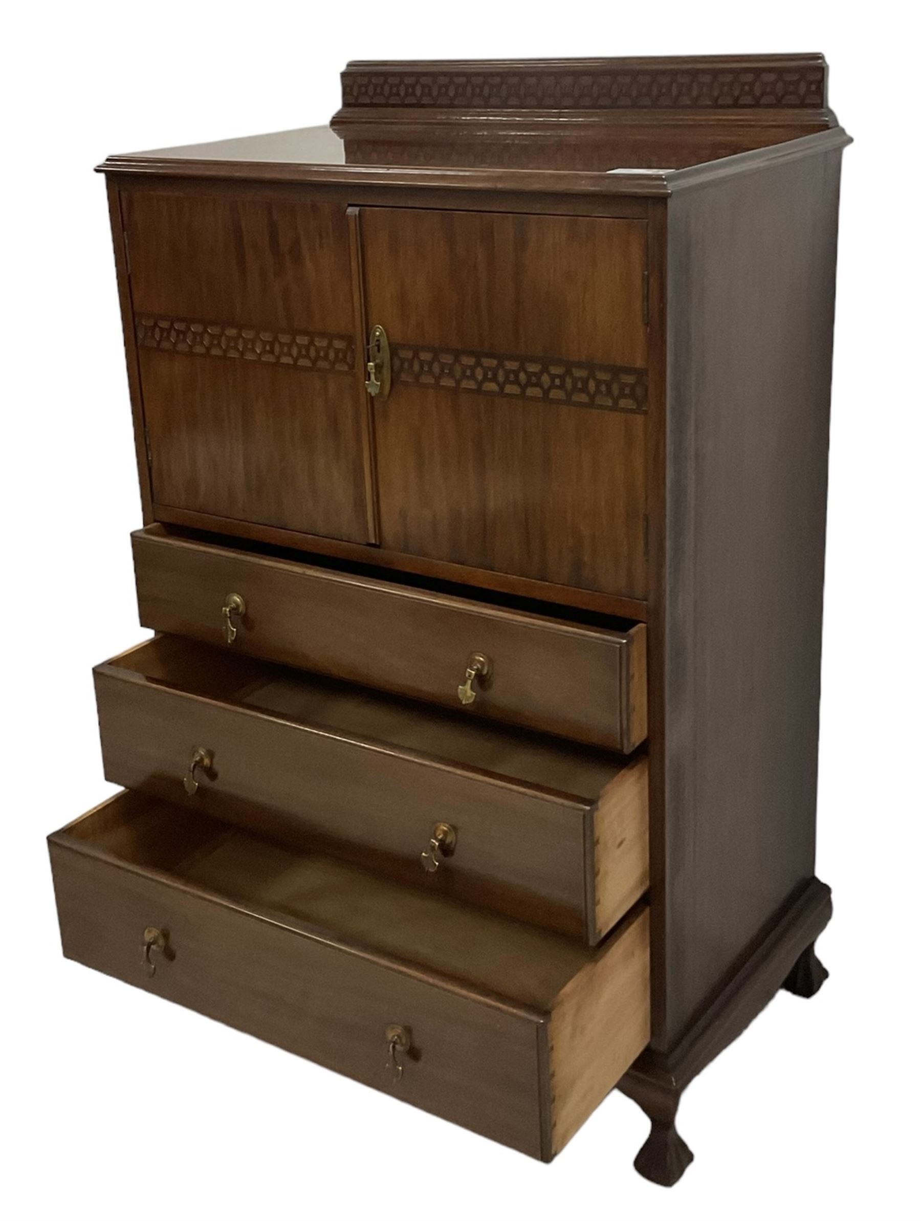 Early 20th century mahogany tallboy, double cupboard over three drawers, on ball and claw carved cabriole feet