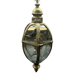 Modern bronze finish glazed lantern of hexagonal tapering form, raised upon bronze finish ...