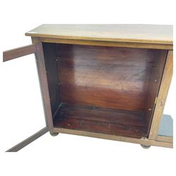 Early 20th century mahogany bookcase, rectangular top over two glazed doors, fitted with four adjustable shelves, on turned bun feet 