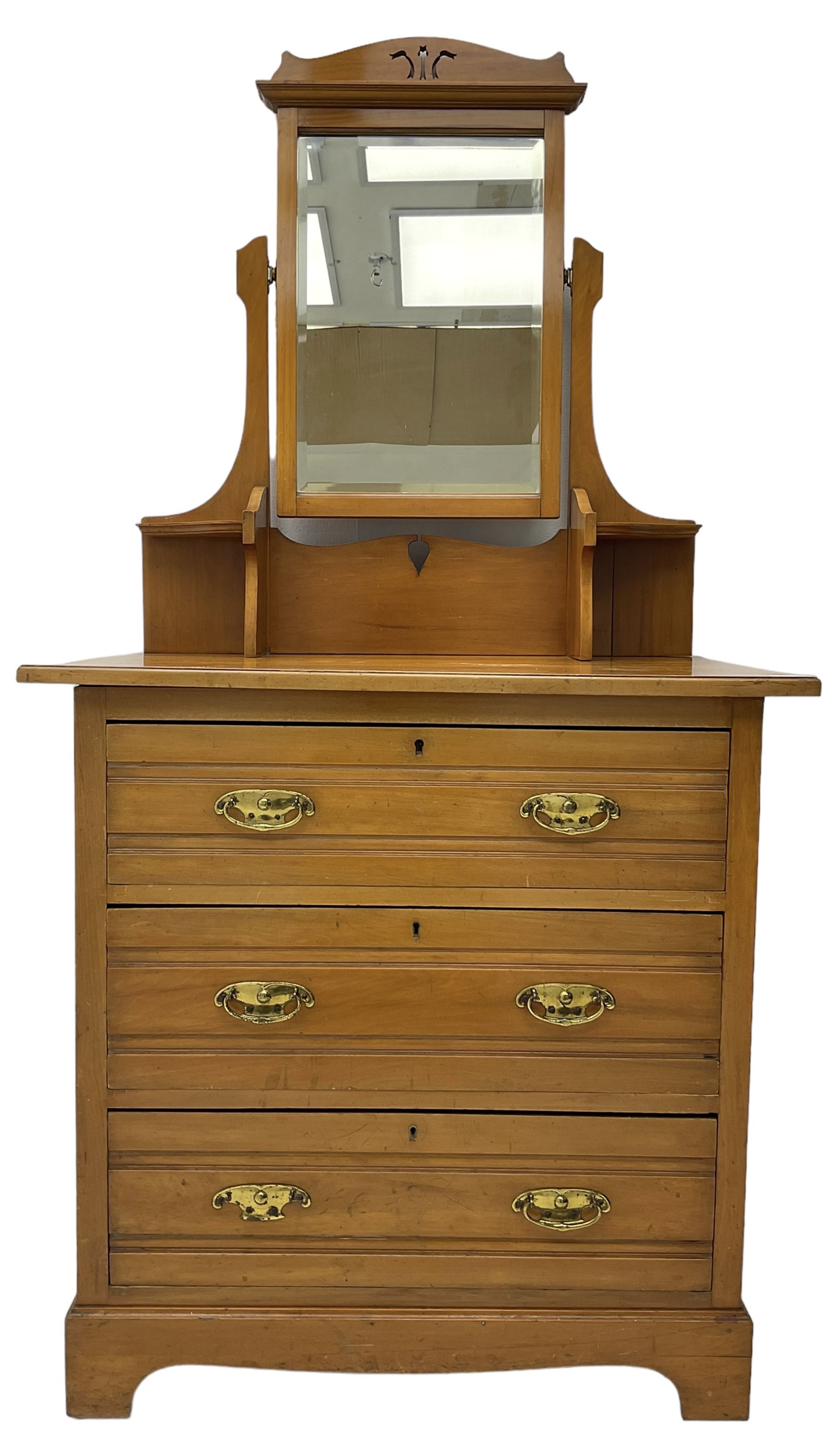 Edwardian satin walnut dressing chest, raised bevelled mirror back, the base fitted with three drawers