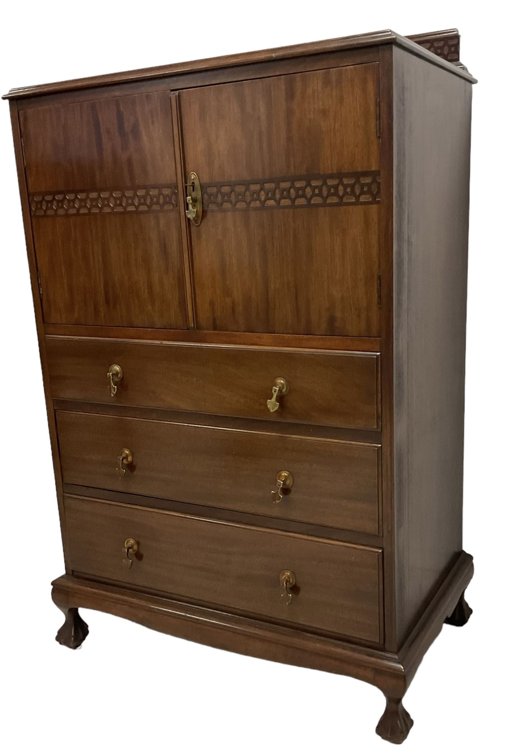 Early 20th century mahogany tallboy, double cupboard over three drawers, on ball and claw carved cabriole feet