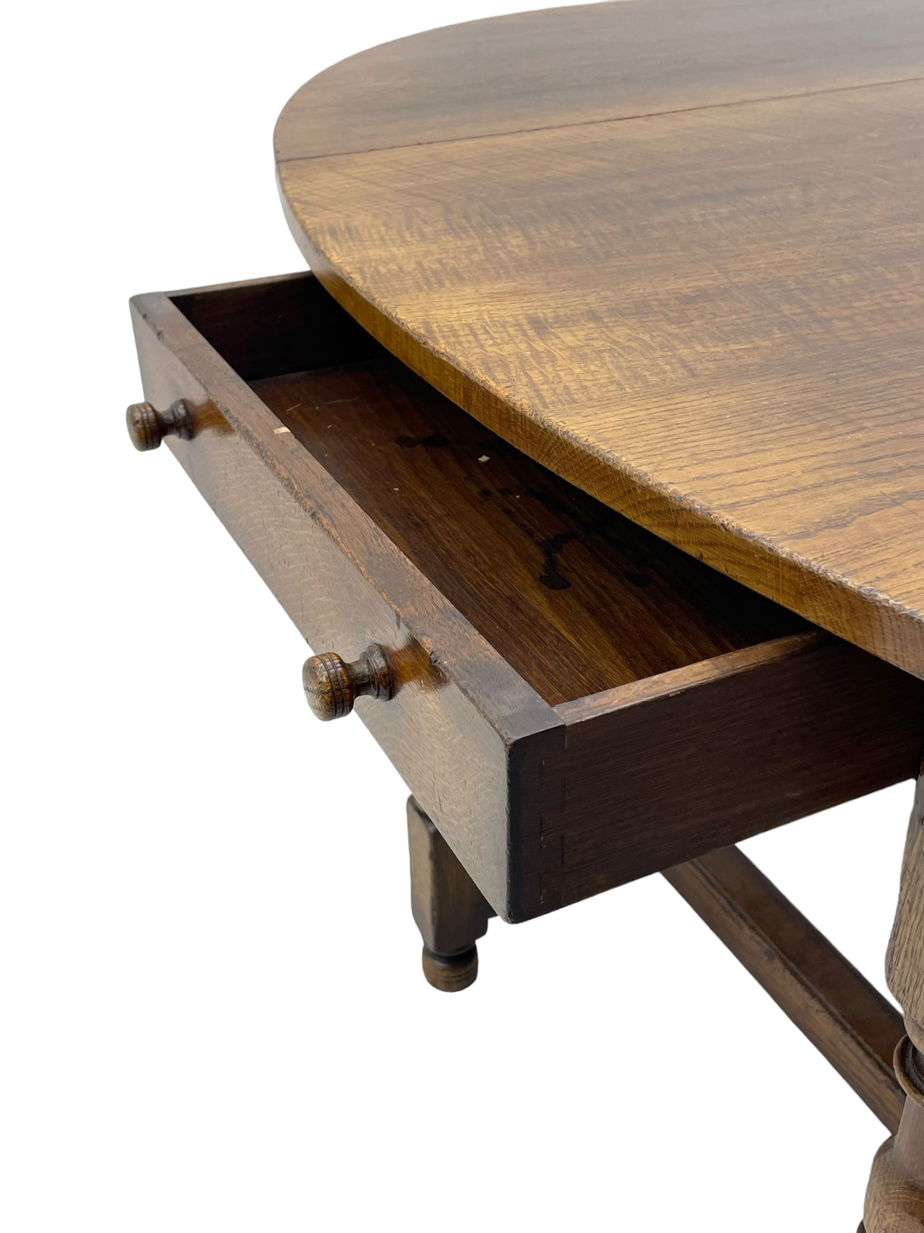 Titchmarsh & Goodwin - 17th century design oak drop leaf dining table, oval top with hinged drop leaves, single drawer to one side with applied makers label, baluster-turned supports united by stretchers