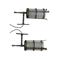 Wrought metal ceiling light, four branch with strapwork lanterns (D55cm); together with a pair of matching wall sconces (H32cm)