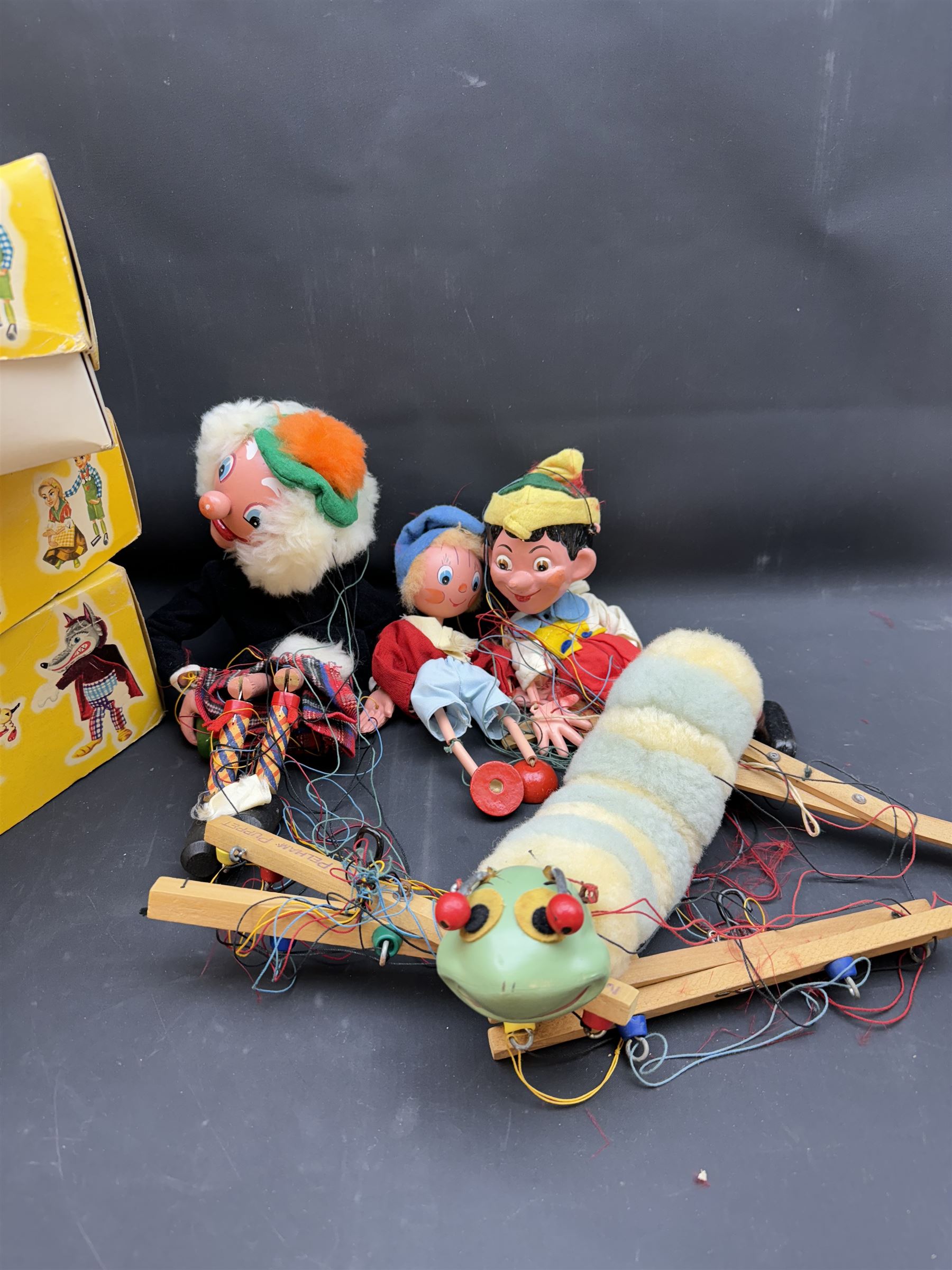 Four Pelham Puppets and a theatre, to include Macboozle SM4, Pinocchio SL1, Caterpillar and Noddy, three puppets and theatre boxed