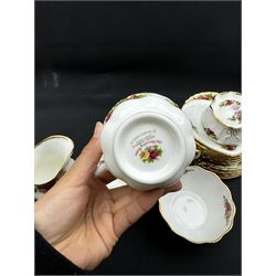 Royal Albert Old Country Roses tea service for six, comprising teapot, milk jug, open sucrier, cups and saucers, dessert plates, two trinket dishes covered jar and clock