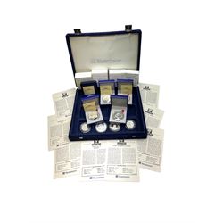 Nine commemorative coins relating to the France 1998 World Cup, some cased with certificates, in a blue coin storage box