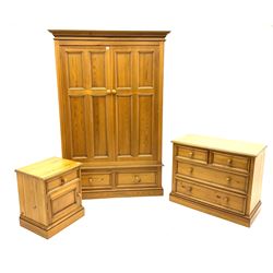 Polished pine bedroom set - double wardrobe fitted with two drawers (W135cm, H200cm, D62cm), chest fitted with two short and two long drawers (W92cm, H76cm, D46cm), bedside cabinet fitted with drawer and cupboard (W52cm, H61cm, D43cm)